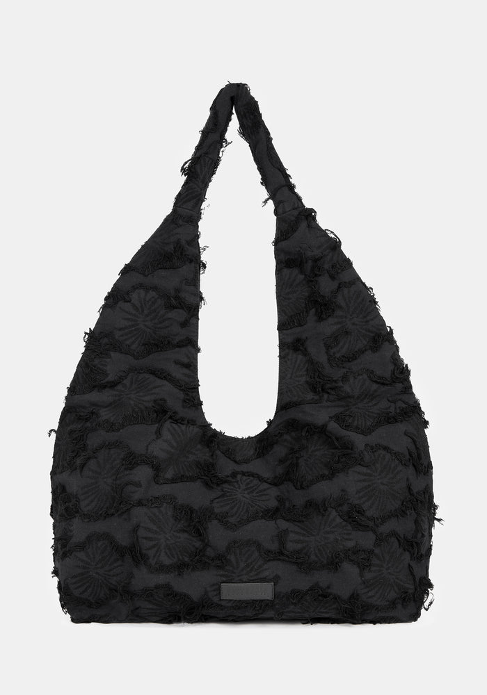 Black textured handbag on a white background